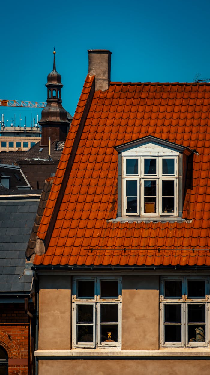 Close-up of vibrant orange rooftops showcasing traditional Danish architecture in Copenhagen.